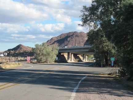 After several long, straight miles, old Route 66 curves and ducks under the freeway as it enters Newberry Springs
