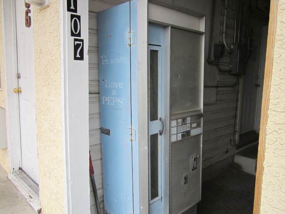 An old vending machine sits in an alcove between units at Barstow's Route 66 Motel