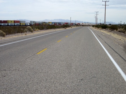 East of Daggett, one of several long cargo trains passes by