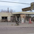 An old Italian restaurant and gas station sits in Newberry Springs behind a fence