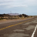 I ride up a gentle hill through the lava field area of old Route 66 east of Newberry Springs
