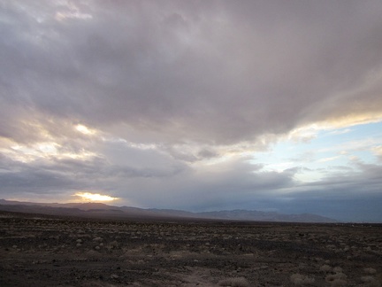 It has been cloudy most of the day, but a bit of sun is peering through the clouds as sunset approaches along old Route 66