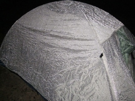 The rain on my tent makes it look metallic with the camera flash; the rain has stopped and it's time to go to sleep!