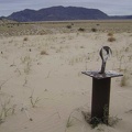 A few hoops like these are mounted on sturdy metal posts in a sandy area a short distance from the road