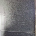 Etched into the sheet metal wall is an oil-change reminder