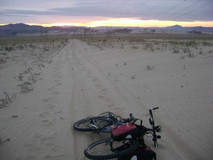 I head back up the power-line road to camp, looking back toward Sands
