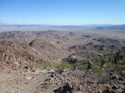 I take a half-hour break on this saddle in the Sleeping Beauty mountains, eat an energy bar, and suck back more water