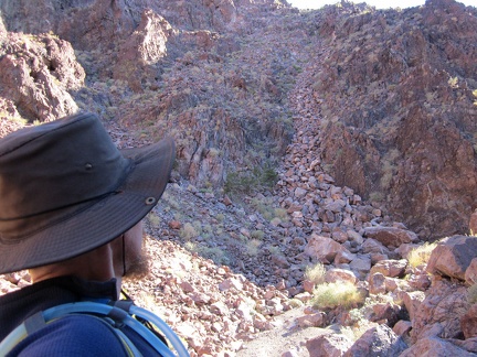 A river of rock flows down a hill toward this Sleeping Beauty canyon