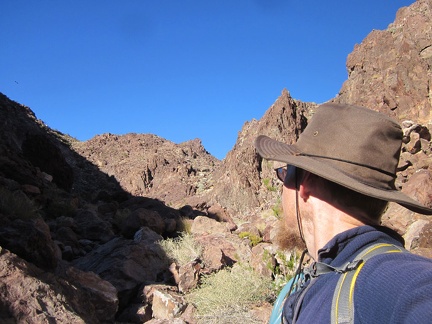 I study my maps a bit and backtrack a quarter-mile up the canyon before turning right and climbing over a rocky ridge