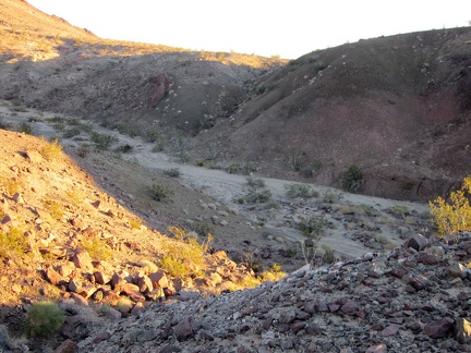 I cross a dry, sandy wash on the way back to my tent