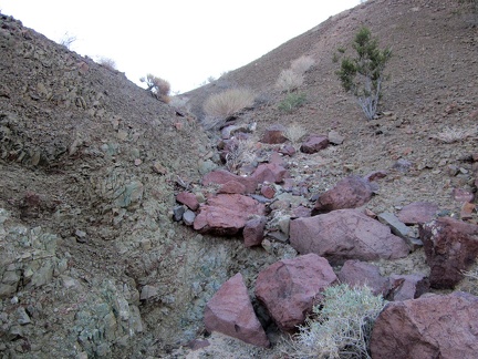 Climbing out of the sandy wash, a few big rocks, and a lot of small ones