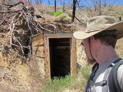 I take a look into the old entrance to the Bluejay Mine before I start climbing up the hill