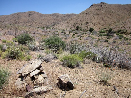 I climb over a small hill to reach the main Globe Canyon Road, and discover a rock cairn on the hill