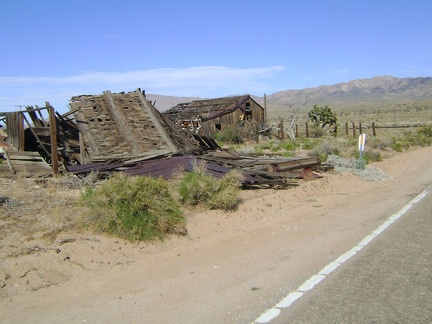 On my way out of &quot;town,&quot; I'll check out these collapsing old houses just up the road from the Cima store