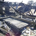 Old hardwood-flooring slats peer out from beneath the debris of this abandoned house at Cima, Mojave National Preserve