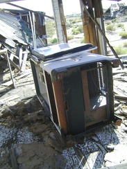 Old refigerator in the back porch of an abandoned house at Cima, Mojave National Preserve