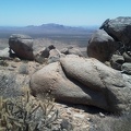 Boulders frame this view over to Hackberry Mountain from the south flank of Table Mountain