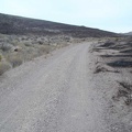 Back on my bike after repairs, Gold Valley Road rises into an area where there has been a brush fire