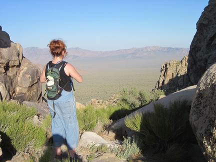 On Teutonia Peak, we linger and enjoy; Heather looks across the valley to the Mid Hills, where we're camping