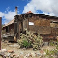 Nearby is a second building, a small cabin: all this in "downtown Searchlight"