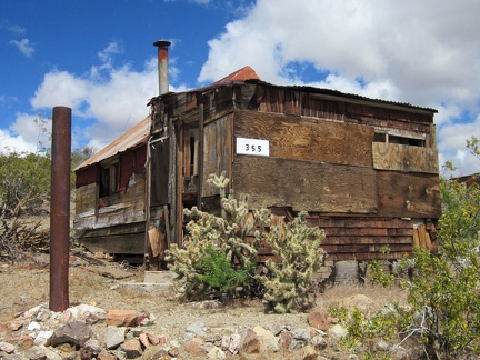 Nearby is a second building, a small cabin: all this in "downtown Searchlight"