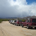 A row of 6 SUVs has stopped by the Walking Box Ranch, apparently preparing for a ride into the rain clouds ahead, like me