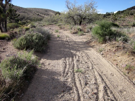 Immediately after the little detour on Castle Peaks Road is another sandy stretch, too deep for me to ride the 10-ton bike