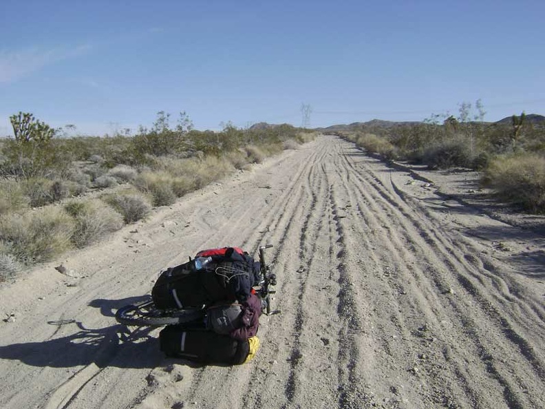 Despite old residual pavement on this road, surface sand and gravel makes it impossible to ride up the gentle slope