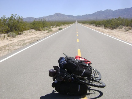 Heading across the valley on Ivanpah Road, the road is big, empty and quiet