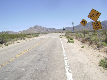 I approach the train tracks that cross Ivanpah Road