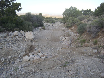  I don't spot another campsite nearby, so I return to the 10-ton bike back at the wash out