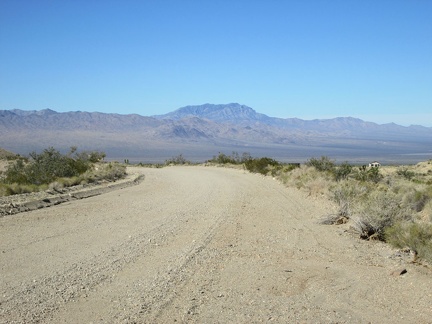 I ride a short distance up Ivanpah Road and turn back to take in the great view across Ivanpah Valley behind me