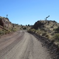 Ivanpah Road passes through a blasted slot through the rocky landscape