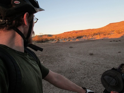 I arrive at a dried-up cattle pond, just before sunset