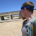 2.5 miles beyond Nipton, I'm feeling hot again and notice some potential shade as I cross under the power lines