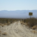 I pass by a road leading down into the Ivanpah Valley toward private property