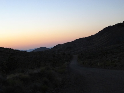 The sun goes down behind me with a nice belt-of-Venus over Ivanpah Valley below as I continue riding up Ivanpah Road
