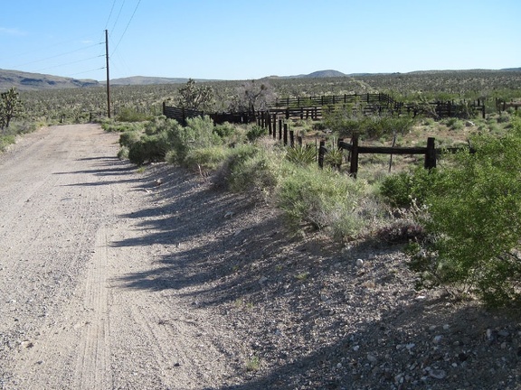 I pass an old corral on Walking Box Ranch Road and check my GPS for directions here