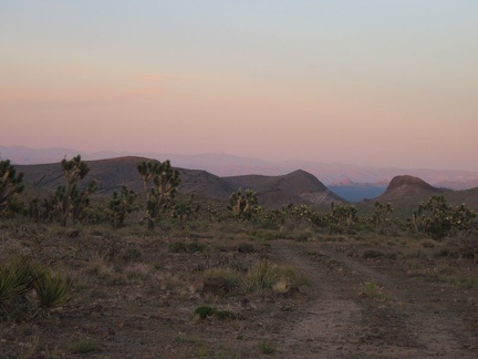 Pink-orange haze sets in over Nevada, east of my campsite near Malpais Spring