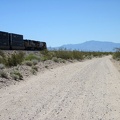 Soonafter, the first train of this trip passes me on bumpy Nipton-Desert Road
