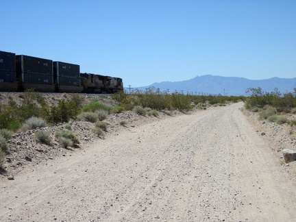 Soonafter, the first train of this trip passes me on bumpy Nipton-Desert Road