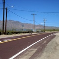 I glance at Nipton's little solar-power plant as I begin the ride up the hill toward Crescent Pass, Nevada