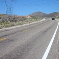 Approaching Crescent Pass, I ride under the power-transmission lines that I'll soon follow into the McCullough Mountains