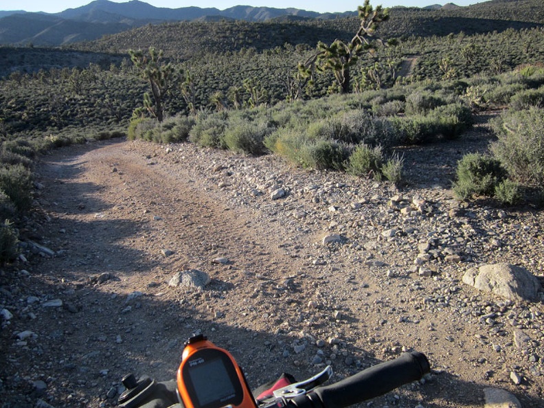 I make my final turn for the day onto a road that winds down and around a few low hills en-route to Pine Spring