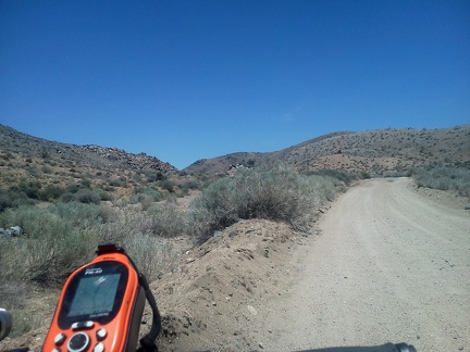 Upper Black Canyon Road narrows somewhat before it crosses through the pass ahead at just under 5350 feet elevation