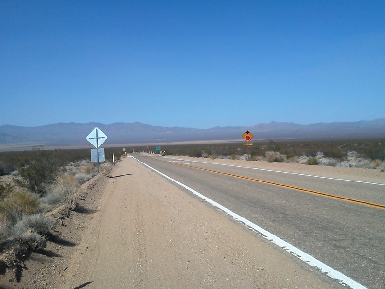 35 minutes later: after 10 miles of gliding downhill (and pedaling too), I arrive at the stop sign and turn left on Ivanpah Road