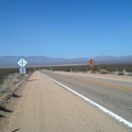 35 minutes later: after 10 miles of gliding downhill (and pedaling too), I arrive at the stop sign and turn left on Ivanpah Road
