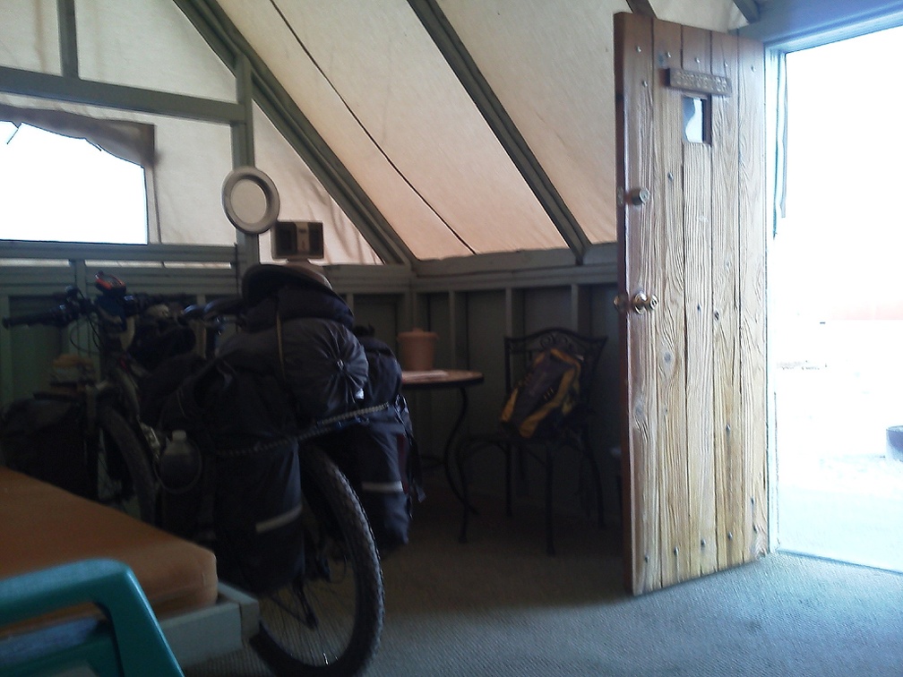 I park the 10-ton bike inside my tent cabin at Nipton, titled the Surveyor, and settle in for the night