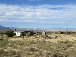 I ride past the old Ivanpah general store building, a landmark in this area