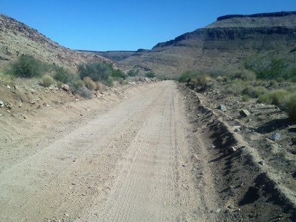 I ride the 10-ton bike slowly on the heavy washboard of this part of Wild Horse Canyon Road